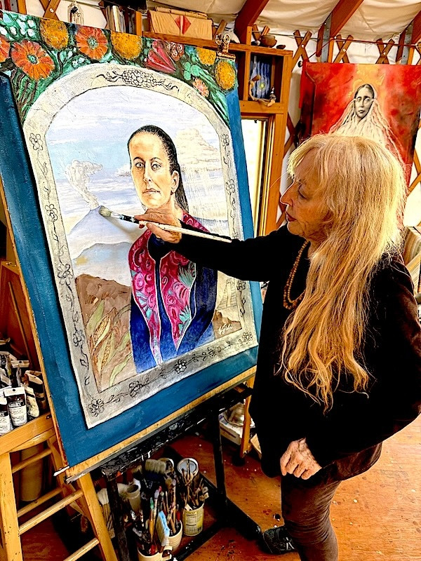 Vijali painting at her easel, 2025