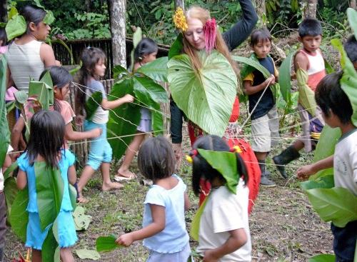 Vijali dancing with Shuar children during ceremony in the Amazon